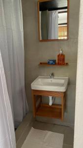a bathroom with a sink and a mirror at Coco Beach in El Paredón Buena Vista