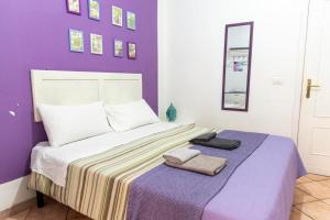 Postel nebo postele na pokoji v ubytování fruitroom rome