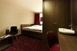 Postel nebo postele na pokoji v ubytování Kongres Hotel Roca + 20 fotografií