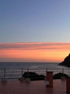 a view of the ocean at sunset at La Casa sul Mare - Monterosso - Cinque Terre in Monterosso al Mare