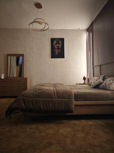 a bedroom with a large bed in a room at Panorama Sea view Studio in Ajman 