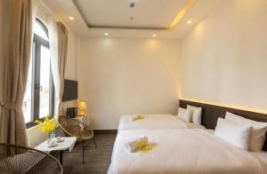 Postel nebo postele na pokoji v ubytování Olagi Hotel 2
