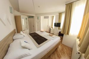 Letto o letti in una camera di Hotel Hayat