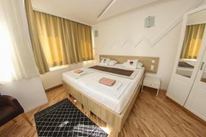 Letto o letti in una camera di Hotel Hayat