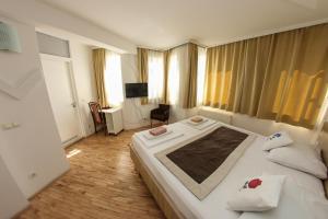 Letto o letti in una camera di Hotel Hayat