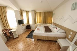 Letto o letti in una camera di Hotel Hayat