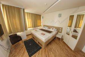 Letto o letti in una camera di Hotel Hayat