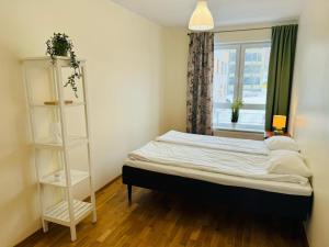 Postel nebo postele na pokoji v ubytování Raatuse 85 Deluxe Apartments