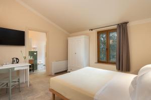Agriturismo Tenuta i 4 venti客房内的一张或多张床位