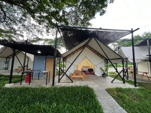 a tent is set up in a yard at Glamping at Xscape Tambun in Tambun