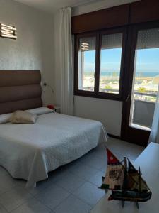 Postel nebo postele na pokoji v ubytování Hotel Touring
