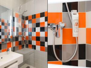 a bathroom with a shower and a sink at ibis Styles Caen Centre Historique in Caen