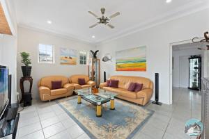 a living room with two couches and a coffee table at Aircabin - Blakehurst - Spacious - 5 Beds House in Sydney