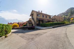 a house on the side of a road at Marigold Apartment by Wonderful Italy in Bellagio