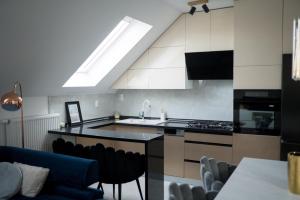 a kitchen with a sink and a counter top at Apartman “Manhattan” in Križevci