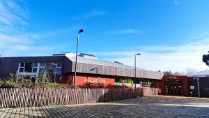 a building with a fence in front of it at Argousiers 123 in Fort-Mahon-Plage +3 photos