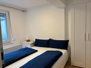 Ένα ή περισσότερα κρεβάτια σε δωμάτιο στο Wick Home Apartment 1 Lahr-Burgheim
