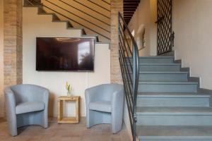 Agriturismo Tenuta i 4 venti的电视和/或娱乐中心