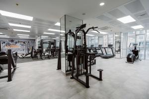 a gym with a lot of treadmills and machines at Best Western Plus Batumi in Batumi
