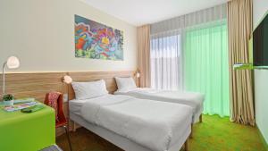 Postel nebo postele na pokoji v ubytování Hey Lou Hotel Hildesheim