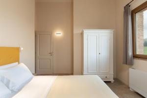 Agriturismo Tenuta i 4 venti客房内的一张或多张床位