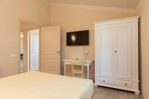 Agriturismo Tenuta i 4 venti客房内的一张或多张床位