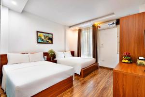 Postel nebo postele na pokoji v ubytování S79 Ami Hotel