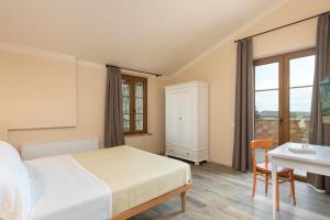 Agriturismo Tenuta i 4 venti客房内的一张或多张床位