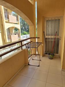 a balcony with a table and a window at TERPSICHORE Holiday Apts in Limassol