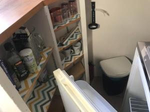 a small bathroom with a toilet and a sink at Mumbasa - Gîtes du Fozo - Herbignac - La Roche Bernard in Herbignac