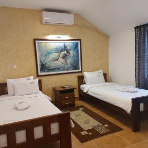 Krevet ili kreveti u jedinici u okviru objekta JOKSIM Rooms&Restaurant