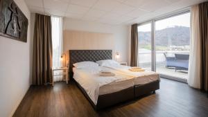 Postel nebo postele na pokoji v ubytování Los Lorentes Apartments Bern Airport