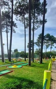 a park with trees and some at Kampaoh Sesimbra in Sesimbra