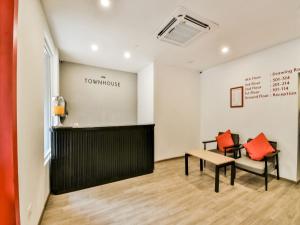 a waiting room with a bench and a table at Townhouse 182 Menka in Patna