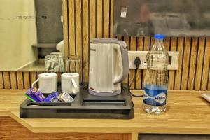 Hotel Aaryan Comforts - Peenya的咖啡和沏茶工具