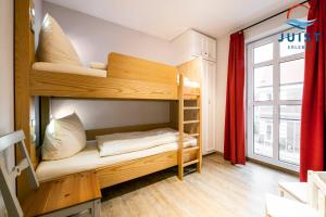 a small room with bunk beds in it at Haus Inselresidenz Strandburg 301 - Wohnung 101 in Juist +14 photos