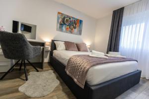 Postel nebo postele na pokoji v ubytování APARTMANI TEA