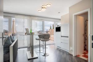 a kitchen with a table and a chair in a room at Studio in Steinhude