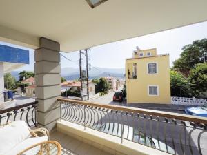 a balcony with a view of a street at CityZEN Apartment with a View in Argostoli