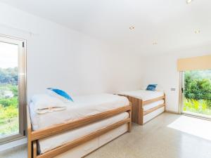Łóżko lub łóżka w pokoju w obiekcie Cubo's Villa El Tejar