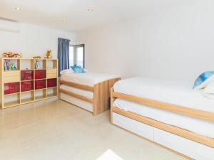 Łóżko lub łóżka w pokoju w obiekcie Cubo's Villa El Tejar