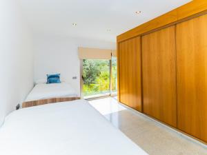 Łóżko lub łóżka w pokoju w obiekcie Cubo's Villa El Tejar