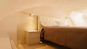 Кровать или кровати в номере LA DIMORA casa vacanze di charme