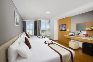 TV a/nebo společenská místnost v ubytování Dendro Gold Hotel