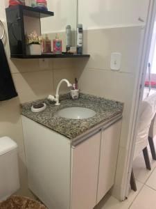a bathroom with a sink and a toilet at Casa Aeroporto Maceió Palmeiras in Maceió