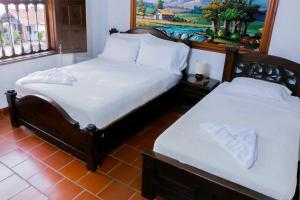 Giường trong phòng chung tại Finca Villa Alicia +23 ảnh