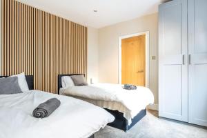 Ένα ή περισσότερα κρεβάτια σε δωμάτιο στο Comfortable flat by MT Property