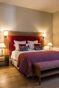Cama ou camas em um quarto em Les Clefs de Troplong Mondot