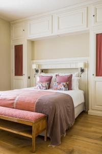 Cama ou camas em um quarto em Les Clefs de Troplong Mondot