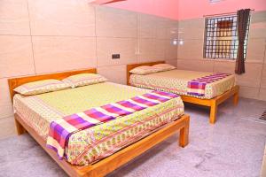 Ένα ή περισσότερα κρεβάτια σε δωμάτιο στο Selva Homestay